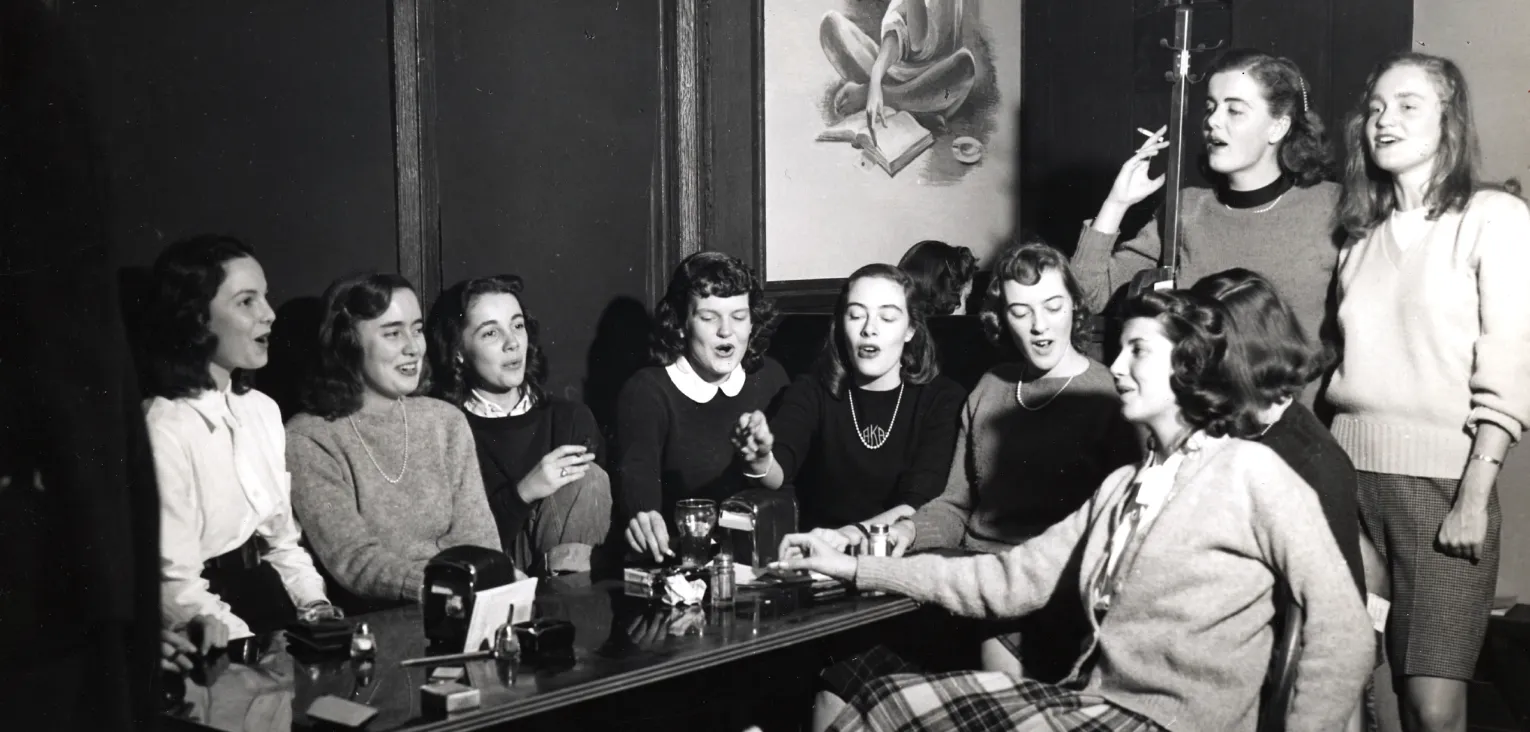 Vintage photo of students socializing in the pub