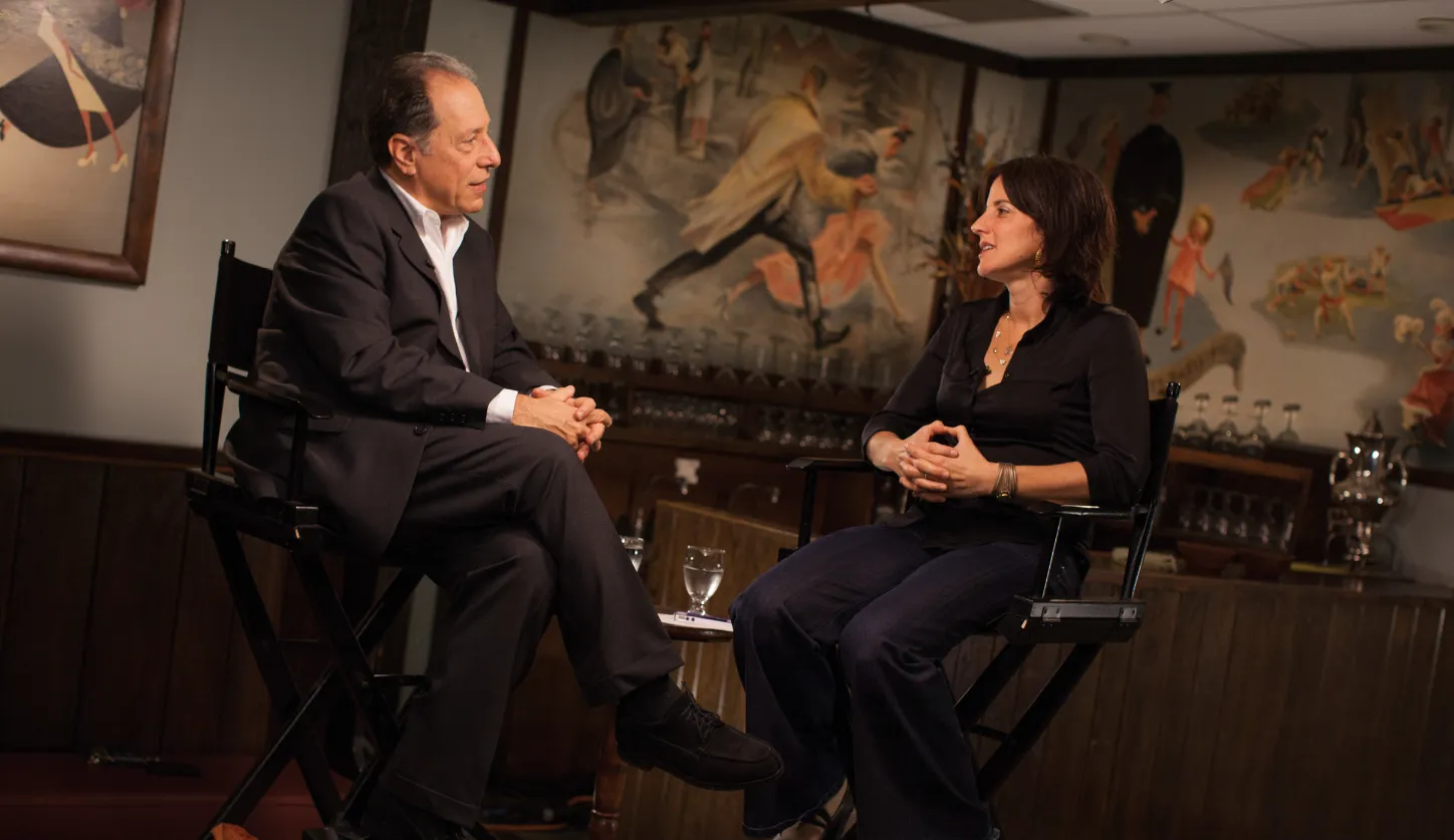 Michael Kimmel ’72 and Rachel Simmons ’96 sitting together in mid conversation