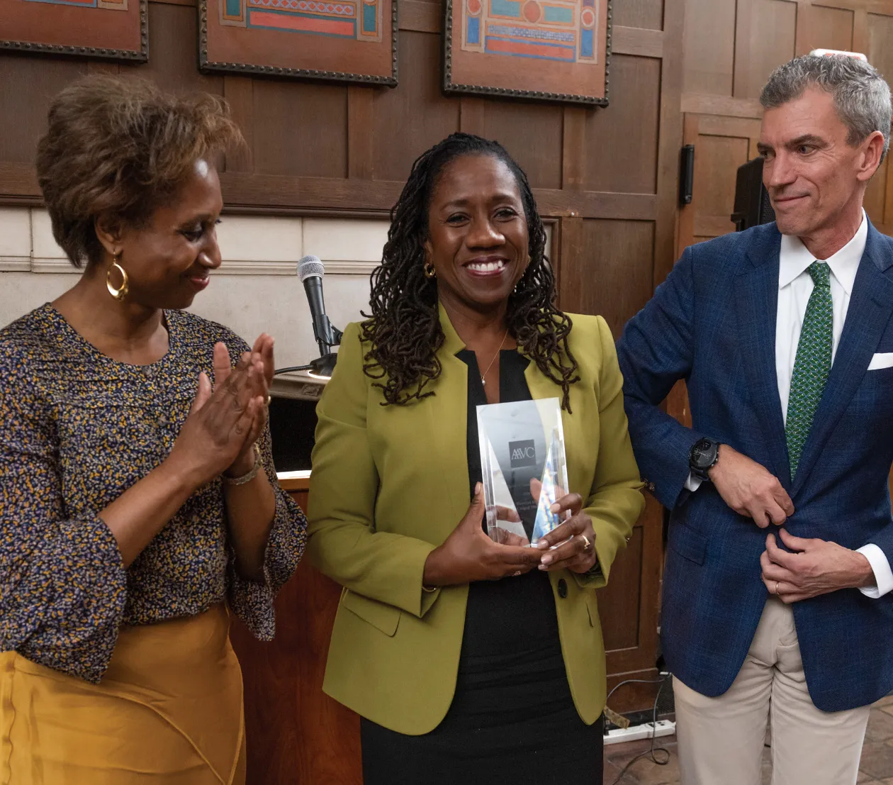 Sherrilyn Ifill surrounded by Sharon Davidson and Steve Hankins receiving the 2019 Spirit of Vassar Award