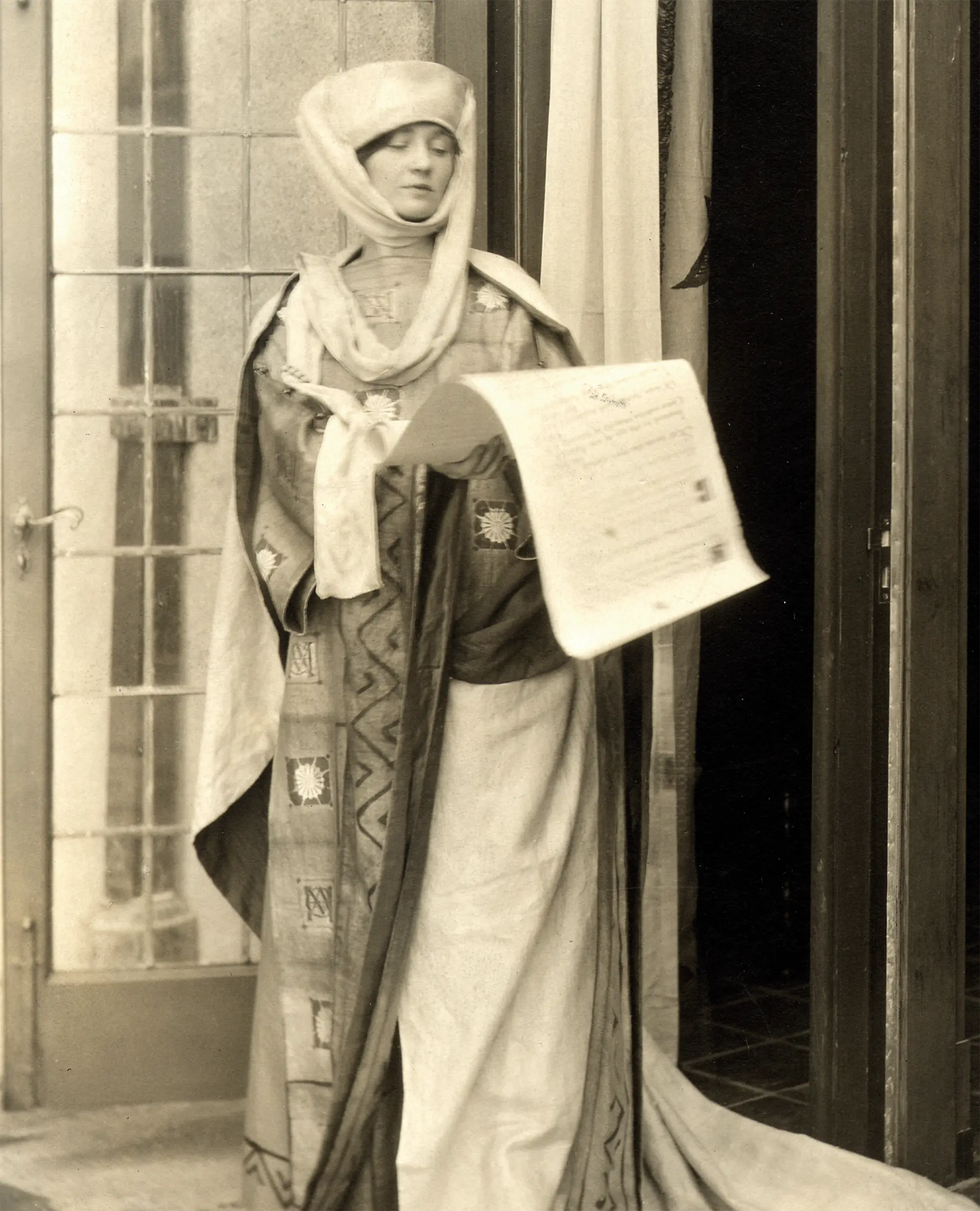 Elizabeth Coonley dressed in medieval dress presented the Scroll of Gifts