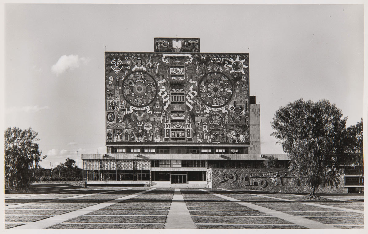 McKenna’s photograph of a library in Mexico, a square building with cultural symbols embedded in the façade.