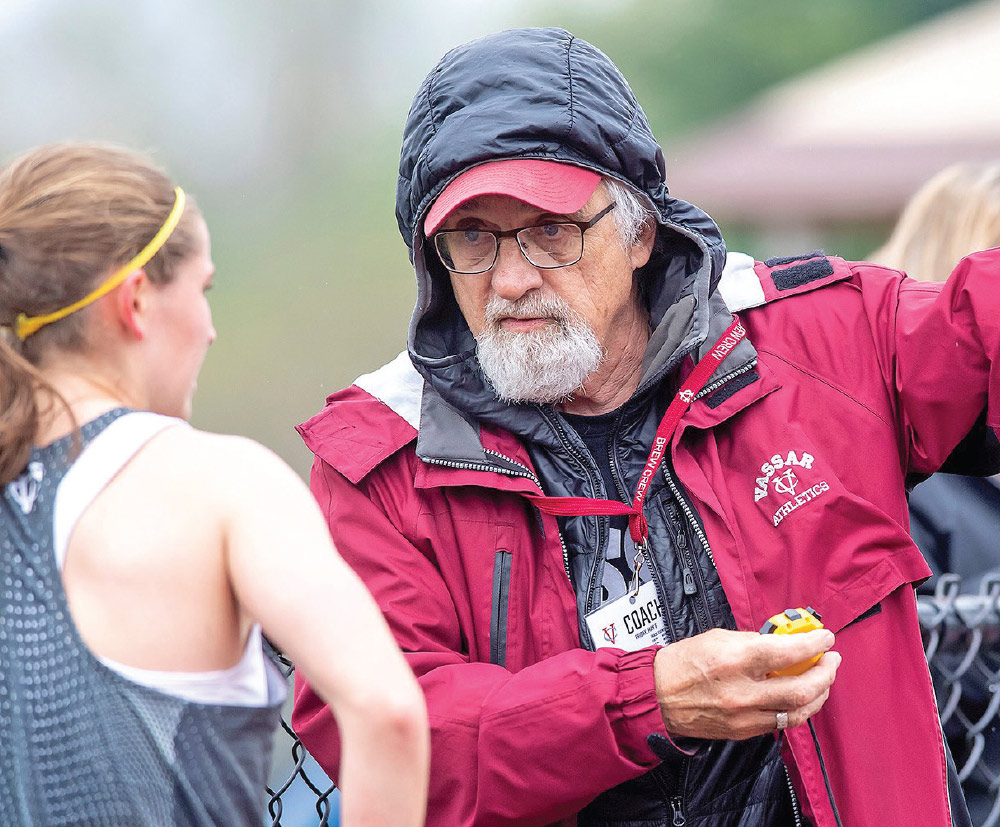 Ronald Stonitsch, retired cross country and track coach, encourages one of his runners.