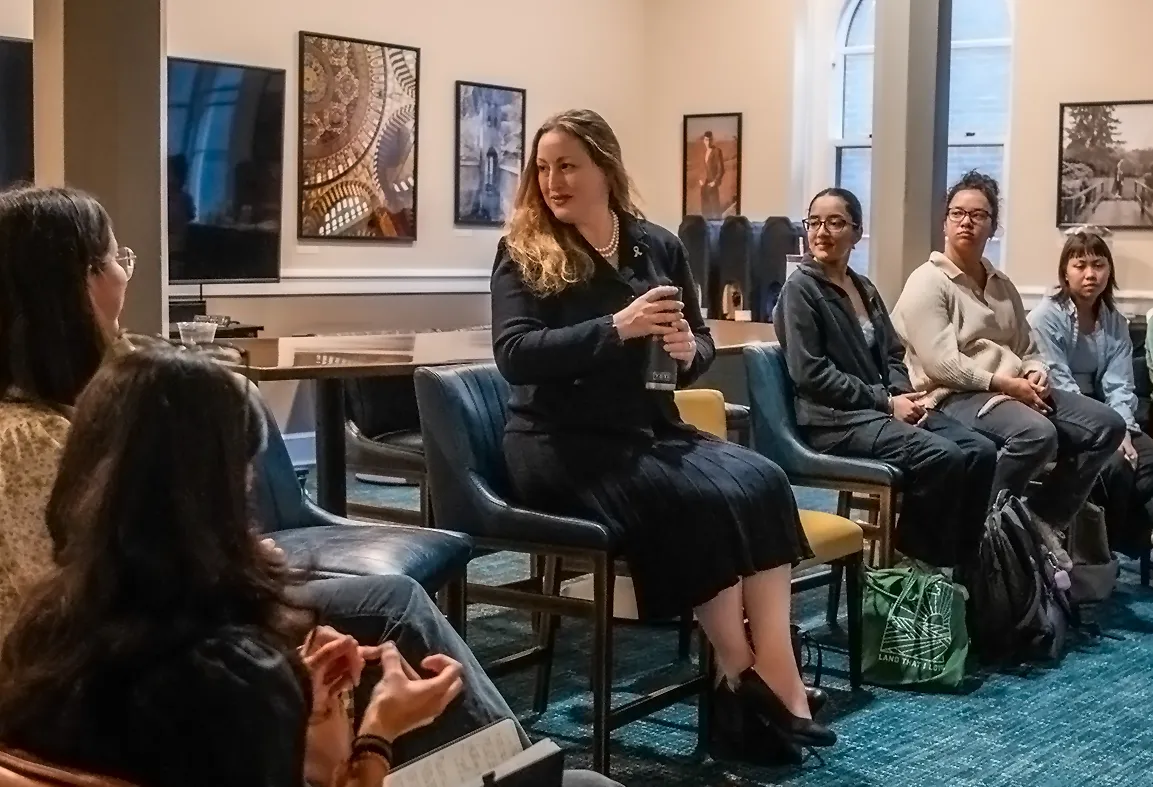 Michelle Monje (’98) talks with several students in Vassar’s Jade Parlor.