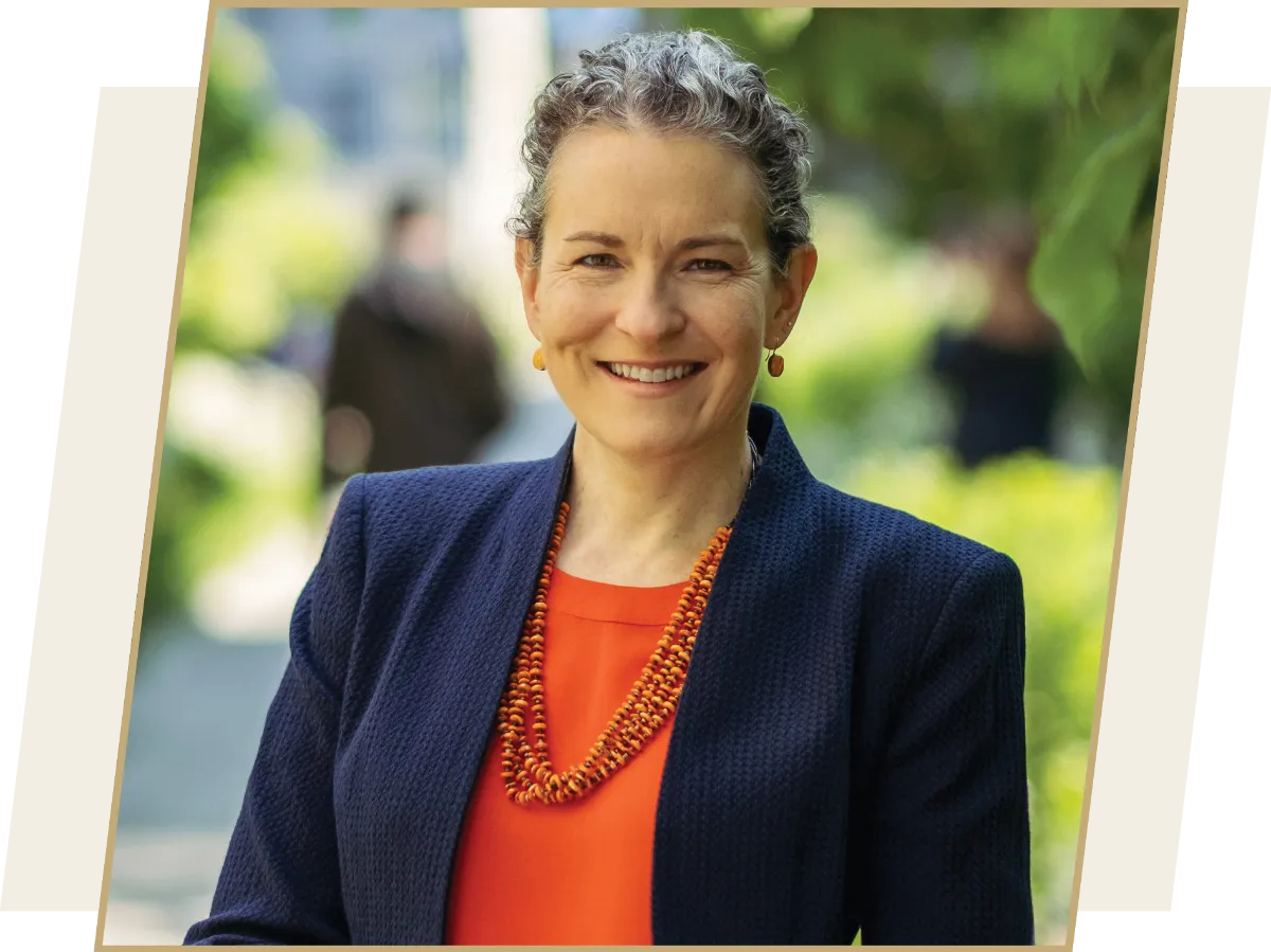 Anne Green (’93), CEO of G&S Integrated Marketing Communications Group, in a red blouse with a navy-blue blazer.