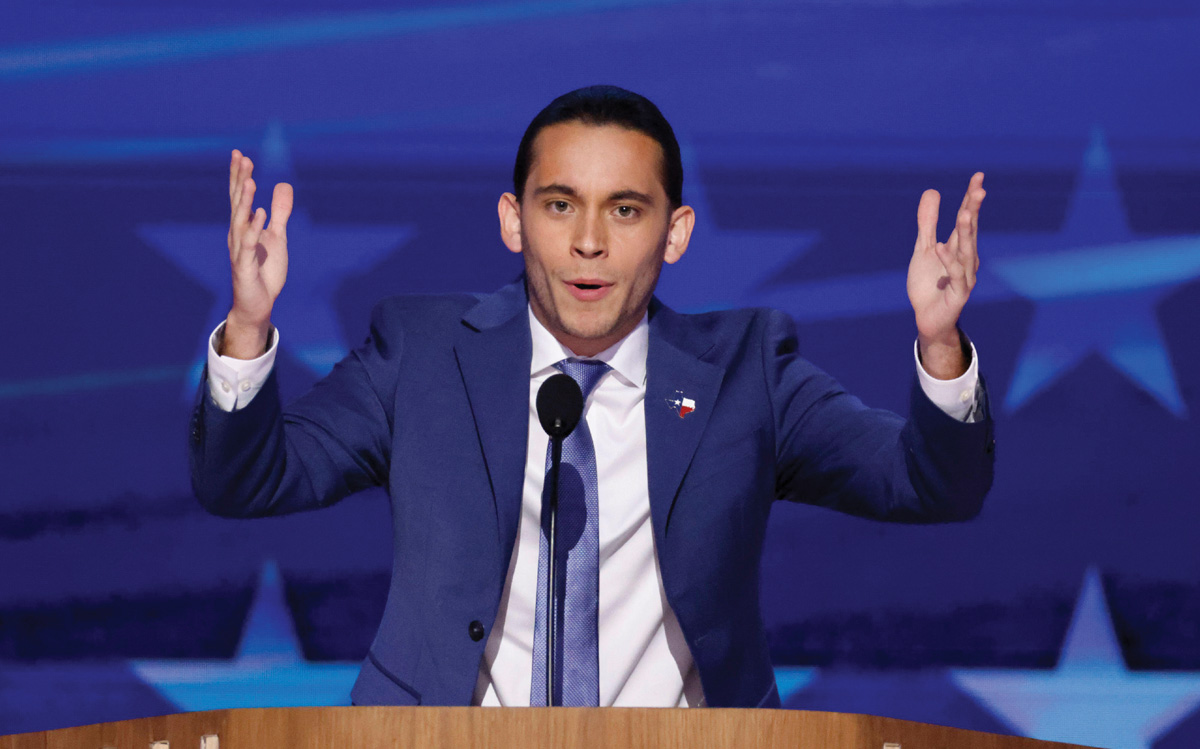 Carlos Espina (’20)animatedly  speaks at the Democratic National Convention, his hands thrown in the air.