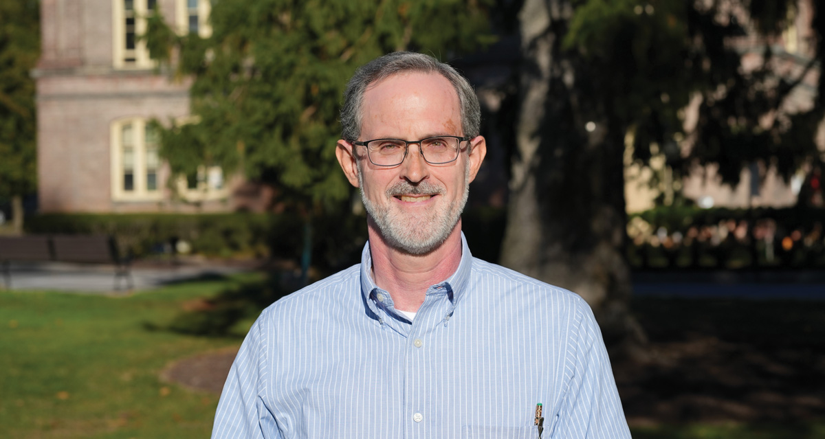 Ken Foster, Vassar’s new Director of Sustainability, in front of Main Building. 