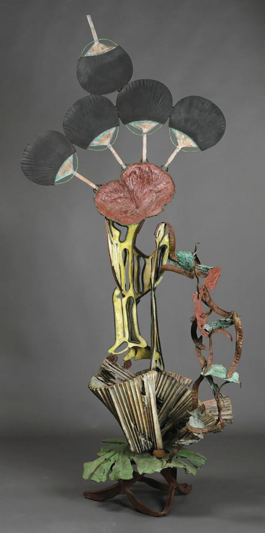 Nancy Graves’ (’61) sculpture shows 5 fans, lampshades, and lotus.