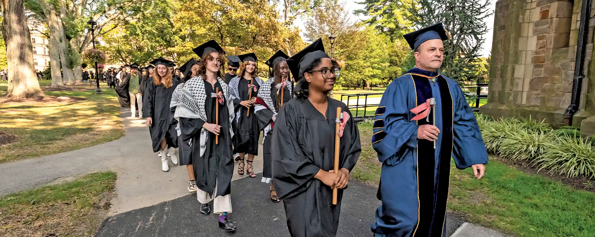 Vassar seniors process to the chapel in cap and gown for Convocation.