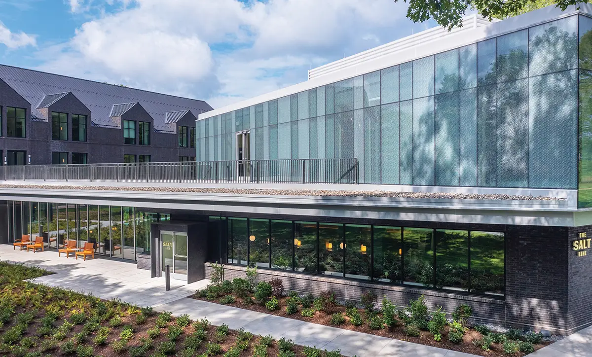 Exterior of the modern, glass building that houses The Salt Line Hudson Valley restaurant