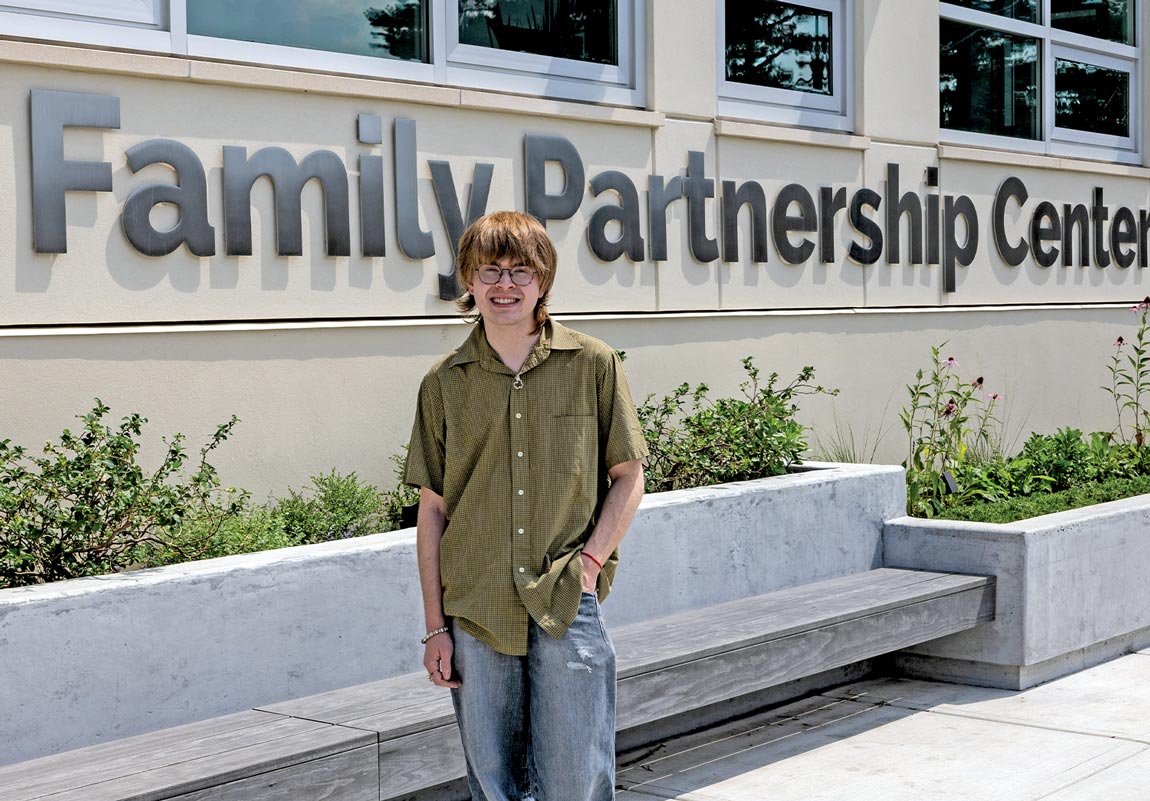 Student Jake Leffort (’27) poses in front of Family Partnership Center.