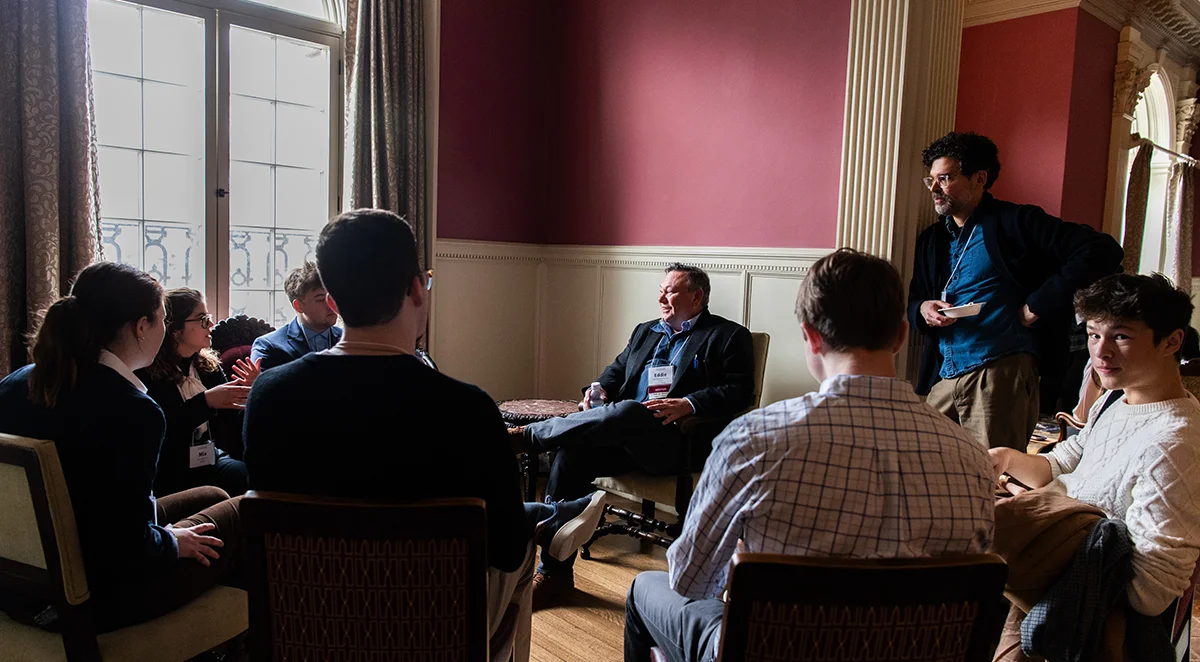 Vassar students sit in a semi-circle in the Rose Parlor while meeting with their sophomore career connection.