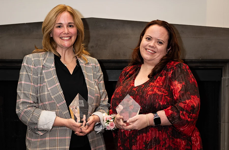 Stacy Bingham, Associate Dean of the College for Career Education and Interim Director of Fellowships, and Jannette Swanson, Director ofExternal Engagement in the Career Education office, smile holding their AAVC’s Outstanding Staff Awards.