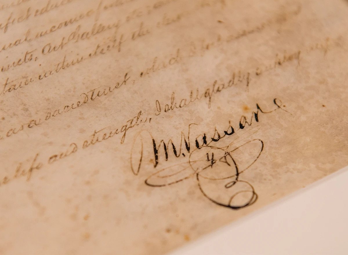 Photo of the bottom of a yellowed document with Matthew Vassar’s signature.