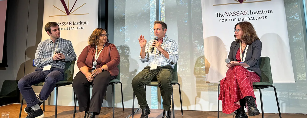 Panelists Mike Gillis of The Onion, Lynette Clemetson of the University of Michigan, podcaster Eric Marcus ‘80, and Professor Dara Greenwood sitting in a row on stage, answering questions.