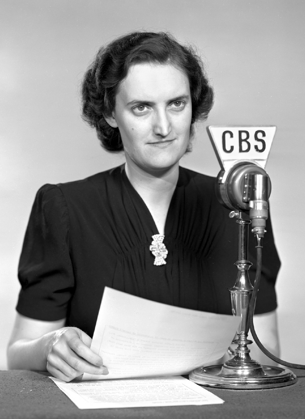 Historical photo of Mary Marvin Breckinridge, from the class of 1927, sitting in front of a CBS news microphone.