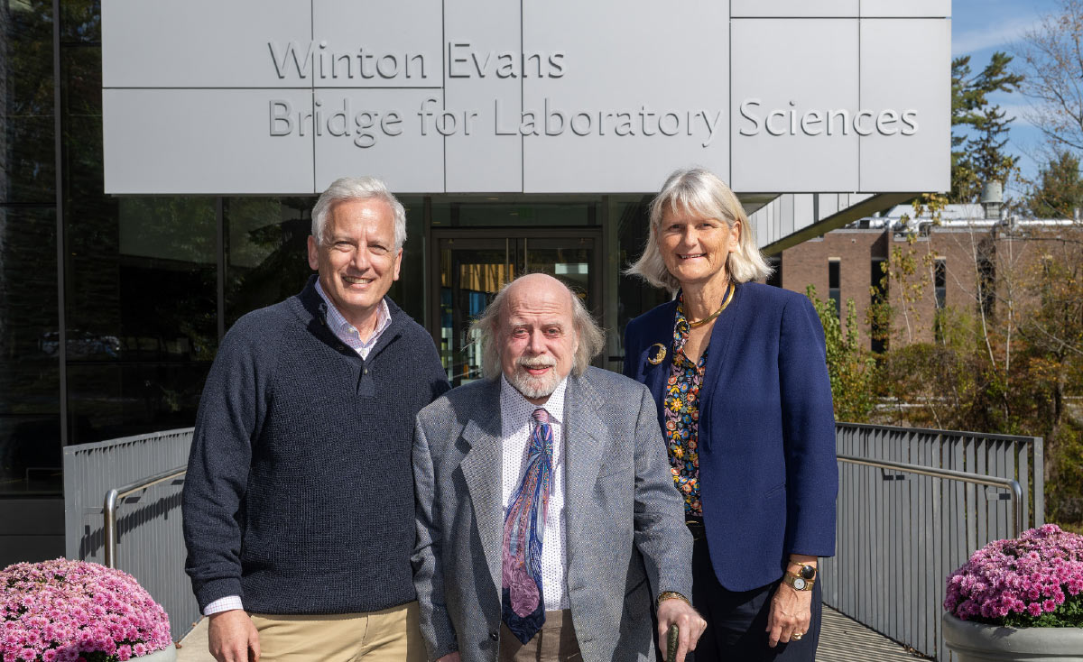 Vice President of Advancement Tim Kane, Rowland Winton Evans ‘75, and President Elizabeth Bradley standing together for a photo in front of the Winton Evans Bridge.