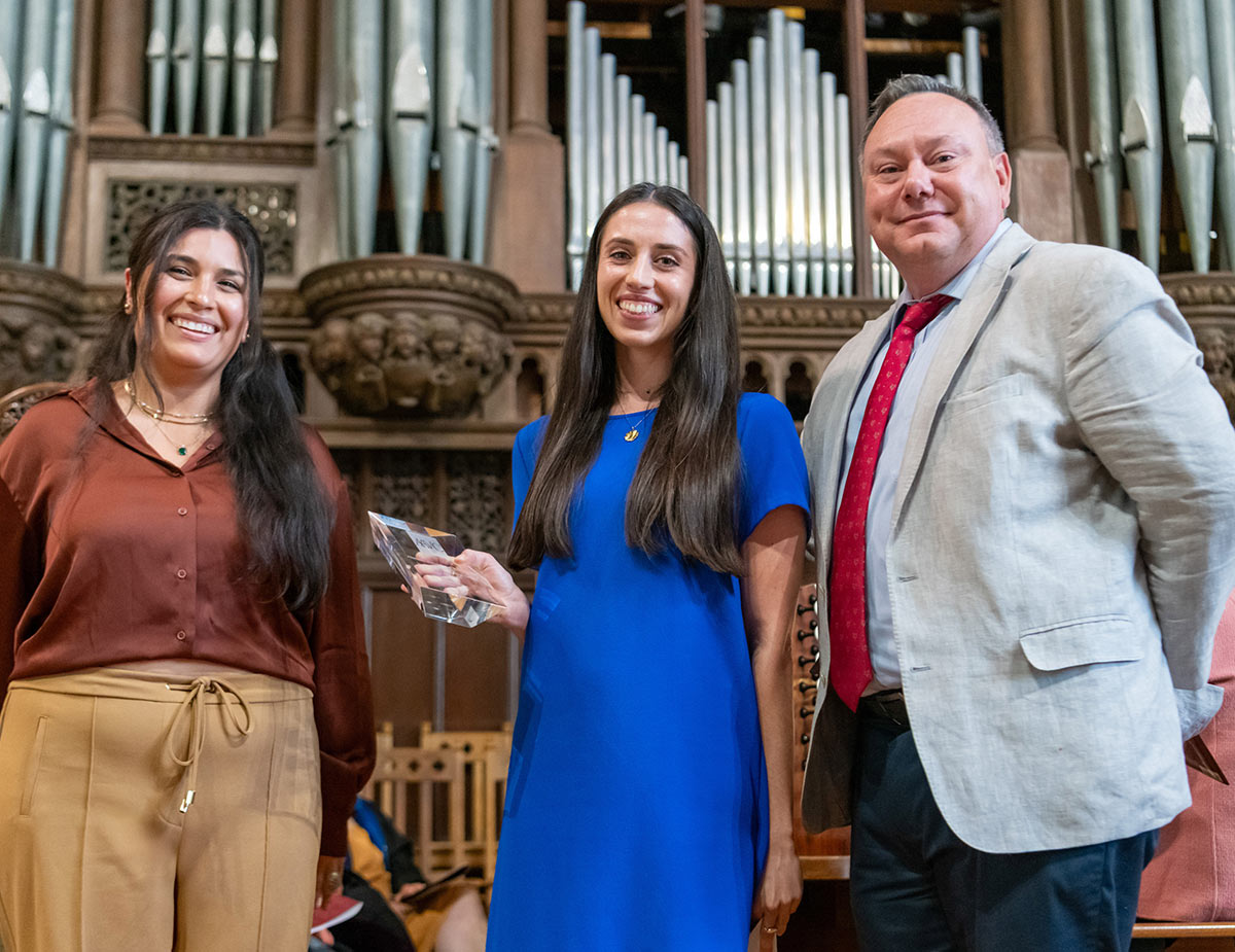 Stephanie Goldberg ‘14 and Edie Gamarra ‘94 providing Elise Shea ‘19 with the AAVC’s Young Alum Achievement Award at the Chapel.