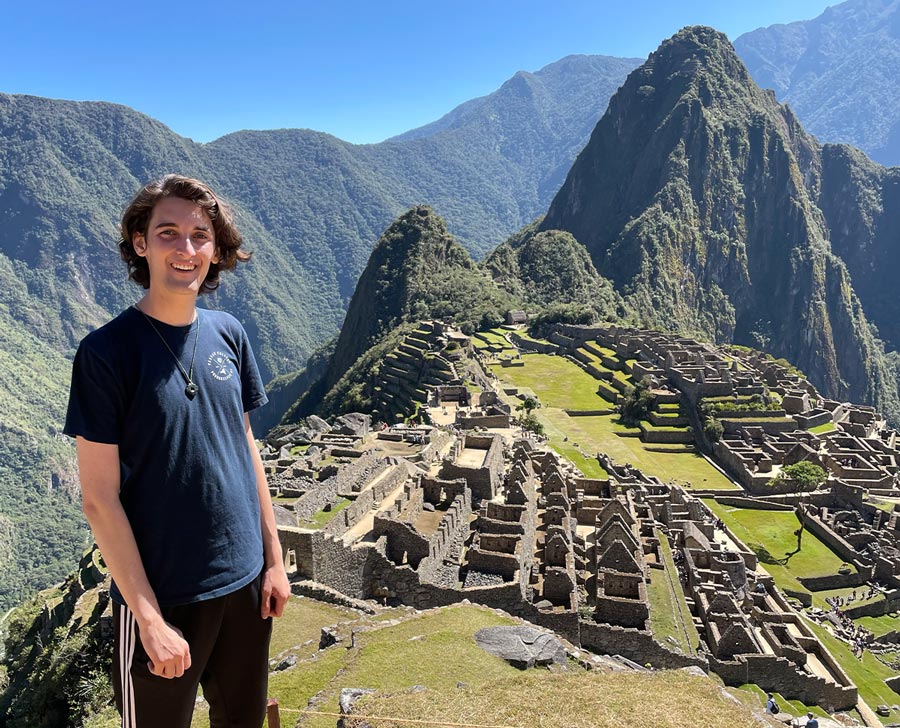 Simon Lewis ‘25 standing above Peruvian ruins during his time abroad.