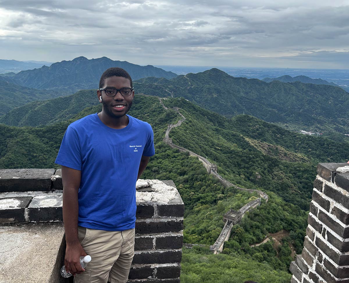 Aryon Turner ’28 standing at the Great Wall of China.