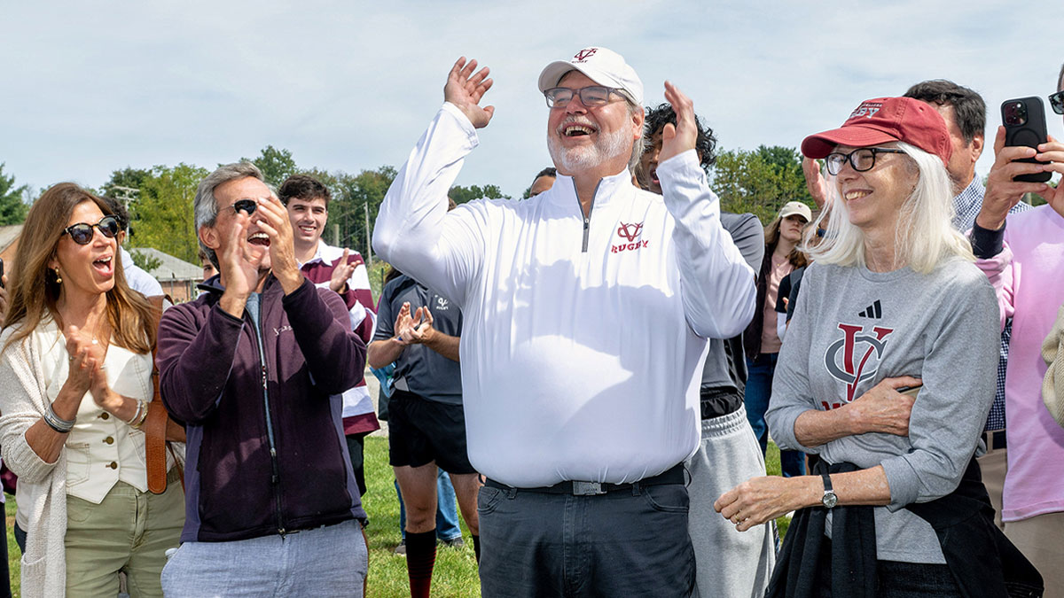 Charlie “Bear” Williams smiling in reaction to finding out that the practice field is being named in his honor.