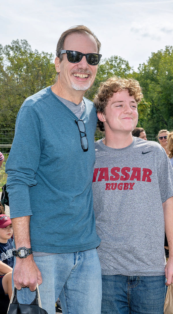 Benefactor Philip White standing with rugby alum Danny White ‘25.