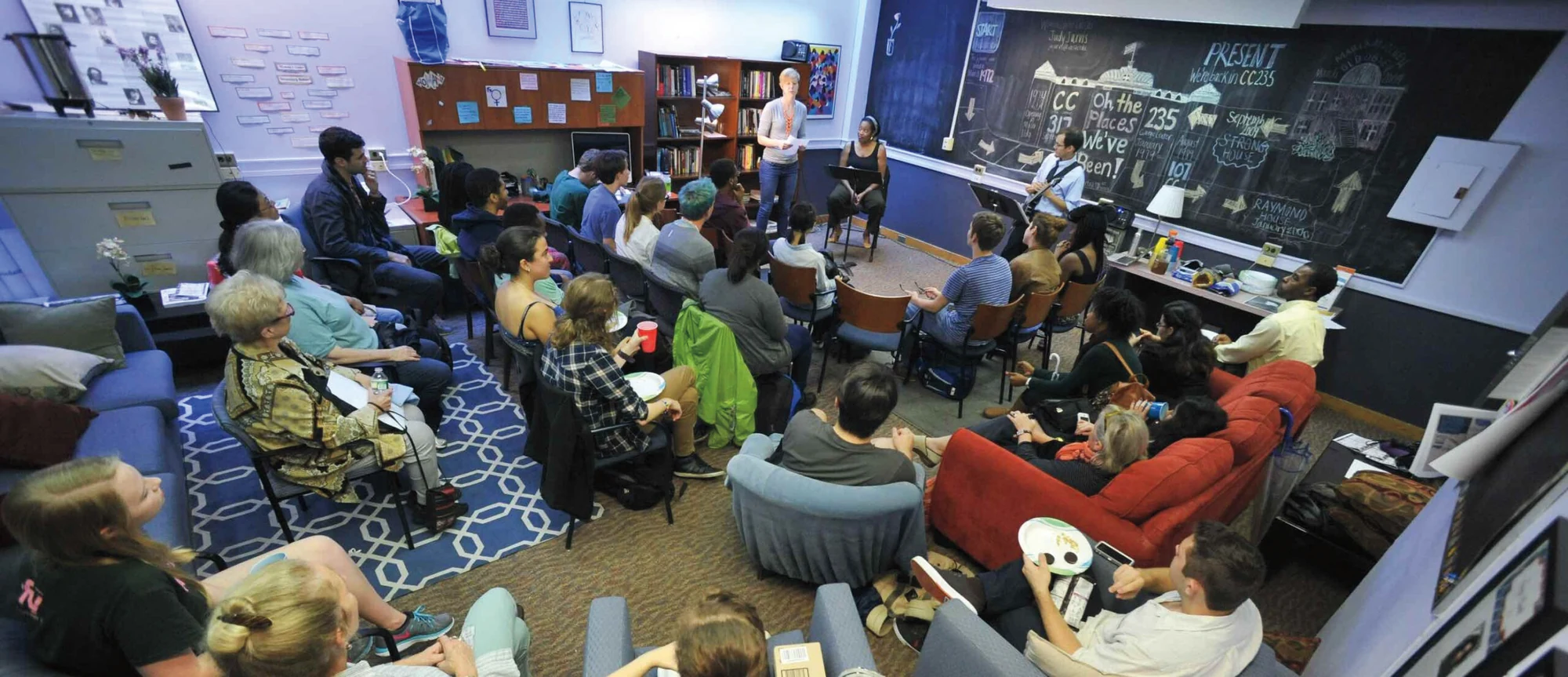 Students sit together in a circle during a gathering inside the Vassar Women’s Center.